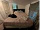 Modest bedroom features bed with dark headboard and minimal decor at 730 Citrus St, Orlando, FL 32805