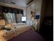 Cozy bedroom includes mirrored closet and a patterned curtain at 730 Citrus St, Orlando, FL 32805
