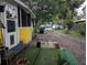 Exterior shot of side yard with house, trees, and neighboring houses in the background at 730 Citrus St, Orlando, FL 32805