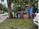 View of front of property with bins on tree lawn at 730 Citrus St, Orlando, FL 32805