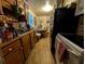 Kitchen with wooden cabinets, sink, stove, and dining table in the background at 730 Citrus St, Orlando, FL 32805