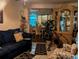 Inviting living room with tile flooring, a comfortable sofa, and a view into the dining area at 730 Citrus St, Orlando, FL 32805