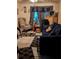 Cozy living room features a comfortable sofa, an armchair, and decorative curtains at 730 Citrus St, Orlando, FL 32805