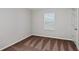 This bedroom features plush brown carpet, a large window, and a standard closet at 1620 Ellesmere Ave, Haines City, FL 33844