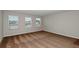 Carpeted bedroom features bright windows and neutral walls at 1620 Ellesmere Ave, Haines City, FL 33844