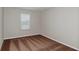 This bedroom features plush brown carpet and one large window that let in plenty of natural light at 1620 Ellesmere Ave, Haines City, FL 33844