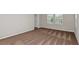 Cozy bedroom with carpeted floors, natural light from the windows, and a convenient closet at 1620 Ellesmere Ave, Haines City, FL 33844
