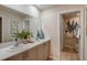 Modern bathroom featuring double sinks, quartz countertops and an attached toilet room at 3823 King Hill Dr, Haines City, FL 33844