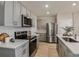 Bright kitchen with stainless steel appliances, quartz countertops, and stylish cabinets at 3823 King Hill Dr, Haines City, FL 33844