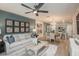 Open floor plan with living room and kitchen in a home with light hardwood floors at 3823 King Hill Dr, Haines City, FL 33844