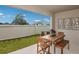 Outdoor patio featuring a wooden table with chairs and view to the backyard at 3823 King Hill Dr, Haines City, FL 33844