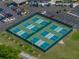 Aerial view of a green and blue fenced-in pickleball court at 6229 Raven Run, Lakeland, FL 33809