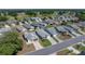 An aerial view of the house nestled within a vibrant community and manicured lawns at 6229 Raven Run, Lakeland, FL 33809