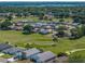 Aerial view of a golf course community with lush green fairways and manicured landscapes at 6229 Raven Run, Lakeland, FL 33809