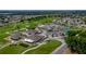 Beautiful aerial view of the golf course and community clubhouse with pool and tennis courts at 6229 Raven Run, Lakeland, FL 33809