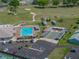 Aerial view of a community pool, bocce ball court, and golf course at 6229 Raven Run, Lakeland, FL 33809