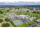 Expansive aerial shot of the golf course and community clubhouse including pool, tennis, and amenity center at 6229 Raven Run, Lakeland, FL 33809