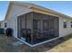 Back exterior showcases a screened-in lanai, adding outdoor living space at 6229 Raven Run, Lakeland, FL 33809
