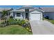 Inviting single-story home with well-maintained landscaping, a one-car garage, and a lush green lawn at 6229 Raven Run, Lakeland, FL 33809