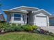 This charming single-story home features manicured landscaping and an attached one-car garage at 6229 Raven Run, Lakeland, FL 33809