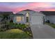 Charming single-story home with manicured landscaping, beautiful lawn, and attached one-car garage at 6229 Raven Run, Lakeland, FL 33809