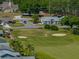 Golf course community with manicured green fairways and sand traps near residences at 6229 Raven Run, Lakeland, FL 33809