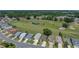 Golf course community with lush green fairways, pond, and manicured landscapes at 6229 Raven Run, Lakeland, FL 33809
