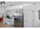 The kitchen features stainless steel appliances and white cabinets at 6229 Raven Run, Lakeland, FL 33809