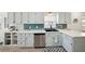 Updated kitchen features stainless steel appliances, tile backsplash, white countertops and breakfast bar at 6229 Raven Run, Lakeland, FL 33809