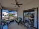 Inviting screened lanai with ceiling fan and comfortable seating for outdoor relaxation at 6229 Raven Run, Lakeland, FL 33809