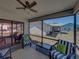 Relaxing screened lanai features comfortable seating and backyard views at 6229 Raven Run, Lakeland, FL 33809