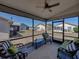Screened patio with comfortable seating and views of the backyard and neighboring houses at 6229 Raven Run, Lakeland, FL 33809