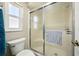 Bathroom with a frosted glass shower enclosure and window at 6229 Raven Run, Lakeland, FL 33809