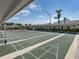 Well-maintained shuffleboard courts, perfect for leisurely outdoor enjoyment under the clear blue sky at 6229 Raven Run, Lakeland, FL 33809