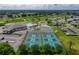 Aerial view of the community tennis and pickle ball courts, with golf course, pool and clubhouse at 6229 Raven Run, Lakeland, FL 33809