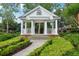 Picturesque gazebo in a landscaped park with a paved walkway surrounded by manicured shrubs at 917 Keep Way Loop, Oviedo, FL 32765