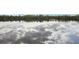 Beautiful lake view reflecting the sky and trees creating a peaceful atmosphere at 917 Keep Way Loop, Oviedo, FL 32765