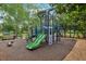 Community playground featuring slides and climbing structures with shaded benches at 917 Keep Way Loop, Oviedo, FL 32765