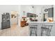 Functional kitchenette offers convenient seating, sleek countertops, and a harmonious blend with the kitchen area at 917 Keep Way Loop, Oviedo, FL 32765