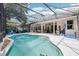 Backyard with large screened-in pool, covered patio, and ample space for entertaining at 917 Keep Way Loop, Oviedo, FL 32765