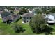 Aerial view of the home showcasing the backyard, second-story balcony, and the neighborhood at 1705 Plantation Pointe Dr, Orlando, FL 32824