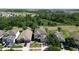 Aerial view of a home surrounded by lush greenery and neighboring houses in a suburban setting at 1705 Plantation Pointe Dr, Orlando, FL 32824