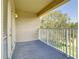 Private balcony area with white railings and wooden flooring provides a nice outdoor space to enjoy the view at 1705 Plantation Pointe Dr, Orlando, FL 32824
