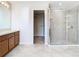 Open-concept bathroom with tiled floor, stand-up shower, and and sinks at 1705 Plantation Pointe Dr, Orlando, FL 32824