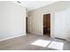 Bedroom with wood-look flooring, closet and ensuite bathroom with great natural light at 1705 Plantation Pointe Dr, Orlando, FL 32824
