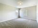Natural light fills this comfortable bedroom featuring plush carpeting and a neutral color palette at 1705 Plantation Pointe Dr, Orlando, FL 32824