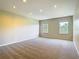 This bedroom features neutral walls, plush carpeting, recessed lighting, and dual windows providing natural light at 1705 Plantation Pointe Dr, Orlando, FL 32824