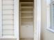 This closet features shelving for organization, and a built in pull-out drawer at 1705 Plantation Pointe Dr, Orlando, FL 32824