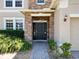 Beautiful stone entryway featuring a well-manicured lawn and a decorative brick walkway at 1705 Plantation Pointe Dr, Orlando, FL 32824
