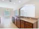 Open kitchen features granite countertops, stainless steel sink, and view to the living area at 1705 Plantation Pointe Dr, Orlando, FL 32824
